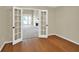 Inviting room featuring hardwood floors with a view of the living area and its fireplace at 4000 Mcpherson Drive, Acworth, GA 30101