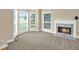 Living room featuring large windows, a fireplace, and neutral-colored walls at 4000 Mcpherson Drive, Acworth, GA 30101