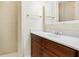 Bathroom featuring a vanity with dark wood cabinets, a white countertop, and a shower at 4400 Hickory Wood Ln, Atlanta, GA 30360