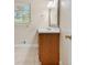 Bathroom vanity with wood cabinets, white countertop, and decorative mirror at 4400 Hickory Wood Ln, Atlanta, GA 30360