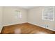 Bright bedroom featuring hardwood floors and natural light from the two windows at 4400 Hickory Wood Ln, Atlanta, GA 30360
