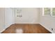 A bright bedroom with hardwood floors, a window, and a closet for ample storage at 4400 Hickory Wood Ln, Atlanta, GA 30360