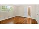 Cozy bedroom with gleaming hardwood floors and an en-suite bathroom at 4400 Hickory Wood Ln, Atlanta, GA 30360