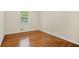 Bedroom featuring hardwood floors and a window offering natural light at 4400 Hickory Wood Ln, Atlanta, GA 30360