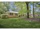 Charming home featuring a well-manicured front yard and classic brick facade at 4400 Hickory Wood Ln, Atlanta, GA 30360