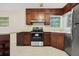 Functional kitchen with stainless appliances, wood cabinets, and ample light at 4400 Hickory Wood Ln, Atlanta, GA 30360