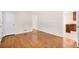 Hardwood flooring in a light-filled living area with an open doorway at 4400 Hickory Wood Ln, Atlanta, GA 30360