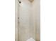 Shower with neutral tile, a shower head, and sleek design at 4400 Hickory Wood Ln, Atlanta, GA 30360