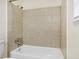 Shower tub combo with white tiling at 4400 Hickory Wood Ln, Atlanta, GA 30360