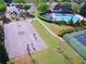 Community aerial view showcasing a playground, pool, tennis court, basketball court, and green spaces at 150 Ivy Chase Loop, Dallas, GA 30157