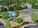 This aerial view showcases the community's amenities, including a pool, playground, tennis courts, and basketball court at 150 Ivy Chase Loop, Dallas, GA 30157