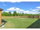 Lush green backyard enclosed by a wooden fence providing privacy and ample space at 150 Ivy Chase Loop, Dallas, GA 30157