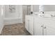 Bathroom featuring double vanity sinks, a separate tub, and a walk-in shower at 150 Ivy Chase Loop, Dallas, GA 30157