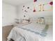 Bedroom featuring a full-sized bed, a toddler bed, and unique wall decorations at 150 Ivy Chase Loop, Dallas, GA 30157