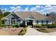 Community clubhouse featuring a welcoming entrance and beautiful landscaping at 150 Ivy Chase Loop, Dallas, GA 30157