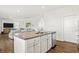 Open-concept kitchen with a spacious island and seamless flow into the living area at 150 Ivy Chase Loop, Dallas, GA 30157