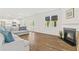 Bright living room with a fireplace, large windows, and comfortable sofa seating at 150 Ivy Chase Loop, Dallas, GA 30157
