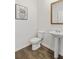Well-lit powder room featuring a sleek pedestal sink, modern fixtures, and stylish decor at 150 Ivy Chase Loop, Dallas, GA 30157