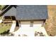 An aerial shot capturing a home's roof, garage, covered porch, and spacious driveway for convenient parking at 5950 Lynfield Dr, Atlanta, GA 30349