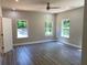 Bright bedroom featuring large windows and hardwood floors with ample natural light at 5950 Lynfield Dr, Atlanta, GA 30349