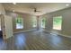 Bright bedroom featuring large windows and hardwood floors with ample natural light at 5950 Lynfield Dr, Atlanta, GA 30349