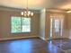 Open-concept dining area with hardwood floors, natural light, and access to the outdoors at 5950 Lynfield Dr, Atlanta, GA 30349