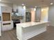Modern kitchen with white cabinetry, quartz countertops, stainless appliances, and center island at 5950 Lynfield Dr, Atlanta, GA 30349
