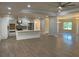 Open-concept kitchen featuring white cabinets, stainless appliances, and views of the dining and living area at 5950 Lynfield Dr, Atlanta, GA 30349