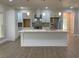 Modern kitchen with white cabinets, stainless steel appliances, and a large center island at 5950 Lynfield Dr, Atlanta, GA 30349