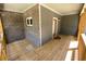 Charming covered porch with wooden deck, brick details, and stylish lighting fixture at 5950 Lynfield Dr, Atlanta, GA 30349