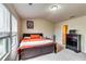Bedroom featuring a bed, dresser, and a large window with natural light at 1155 Magnolia Gardens Walk, Mcdonough, GA 30253