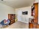 Bedroom featuring dressers, chair, and wall-mounted TV at 1155 Magnolia Gardens Walk, Mcdonough, GA 30253