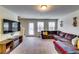 Bright and spacious living room features plush carpeting, and natural light at 1155 Magnolia Gardens Walk, Mcdonough, GA 30253