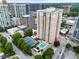 Stunning aerial view of a high-rise condo building with a pool and tennis court at 325 E Paces Ferry Ne Rd # 313, Atlanta, GA 30305