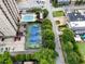 An aerial view of the community tennis court and swimming pool in an urban setting near apartments at 325 E Paces Ferry Ne Rd # 313, Atlanta, GA 30305