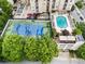 Aerial shot featuring a tennis court and community pool, surrounded by apartments and greenery at 325 E Paces Ferry Ne Rd # 313, Atlanta, GA 30305
