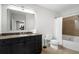 This bathroom has granite countertops, sleek black cabinets, and a shower-tub combo at 325 E Paces Ferry Ne Rd # 313, Atlanta, GA 30305