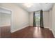 Bedroom with hardwood floors and french doors leading to a balcony at 325 E Paces Ferry Ne Rd # 313, Atlanta, GA 30305