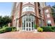 Brick apartment building entrance with beautiful landscaping and a brick sidewalk at 325 E Paces Ferry Ne Rd # 313, Atlanta, GA 30305