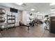 Community gym with treadmills, weights, and television monitors at 325 E Paces Ferry Ne Rd # 313, Atlanta, GA 30305
