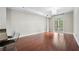 Spacious living room area with hardwood floors and french doors leading to a small balcony at 325 E Paces Ferry Ne Rd # 313, Atlanta, GA 30305