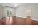 Open living room with hardwood floors and french doors leading to a balcony at 325 E Paces Ferry Ne Rd # 313, Atlanta, GA 30305