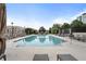 Resort style community swimming pool with lounge chairs and umbrellas with nearby landscaping at 325 E Paces Ferry Ne Rd # 313, Atlanta, GA 30305