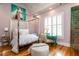 Charming bedroom features hardwood floors, a four poster bed, and natural light from large windows at 3734 Paige Ne Way # 10, Atlanta, GA 30319