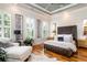 The main bedroom features plantation shutters and a decorative trey ceiling at 3734 Paige Ne Way # 10, Atlanta, GA 30319