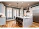 Modern kitchen with a bright island, stainless steel appliances, and hardwood floors at 3734 Paige Ne Way # 10, Atlanta, GA 30319