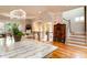 Bright living room with a chandelier, staircase, and views into adjacent dining area at 3734 Paige Ne Way # 10, Atlanta, GA 30319
