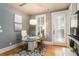 Home office with modern glass desk, lots of natural light, and access to outdoor patio at 3734 Paige Ne Way # 10, Atlanta, GA 30319