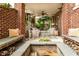 Expansive brick patio with comfortable seating, a fire pit, and stone benches, perfect for outdoor entertaining at 3734 Paige Ne Way # 10, Atlanta, GA 30319