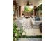 Inviting covered patio with brick accents, ceiling fan, comfortable seating, and stylish outdoor rug, perfect for relaxing at 3734 Paige Ne Way # 10, Atlanta, GA 30319